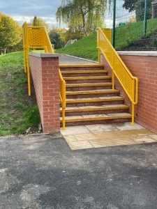 Stairs with yellow bespoke balustrading